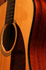 Obraz premium Shapes and curves of an acoustic guitar body.