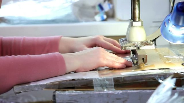 Woman puts in half a rectangle of polyethylene.