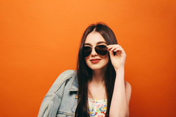 Beautiful teen girl. Hippy. orange background