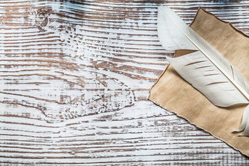 Medieval parchment plume on vintage wooden board