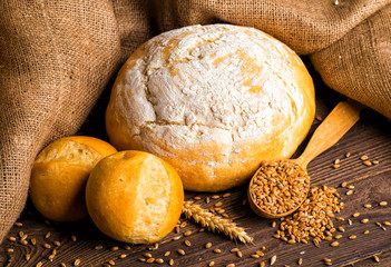 Freshly baked traditional bread with honey on a wooden table