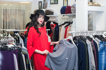 woman thinking what to dress, shopping