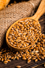 Freshly baked traditional bread with honey on a wooden table