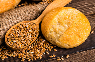 Freshly baked traditional bread with honey on a wooden table