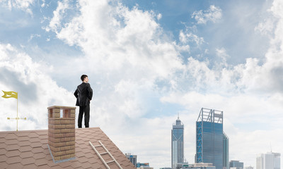 Mister boss on brick roof with arms akimbo. Mixed media