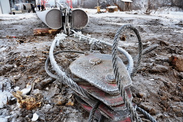 metal construction with a rope covered with frost