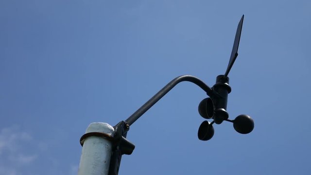 Anemometer, device used for measuring wind speed with blue sky

