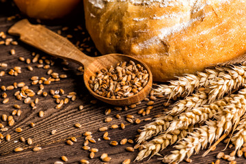 Freshly baked traditional bread with honey on a wooden table
