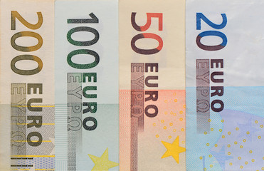 Euro banknotes in a row.