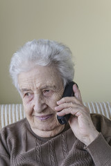 Happy senior woman on phone