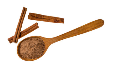 Cinnamon pile and powder on wooden spoon isolated on white background,macro shot