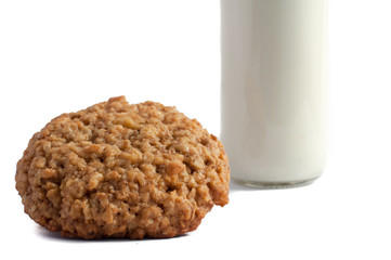 Glass of milk and cookies isolated on white