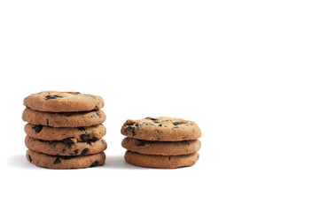 Fototapeta na wymiar cookies with chocolate piled into two stacks of five and three on a white background