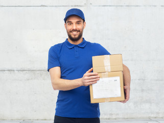 happy delivery man with parcel boxes