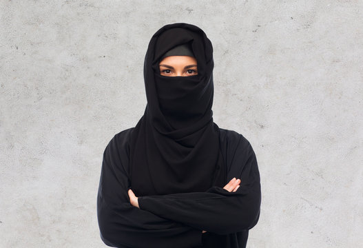 muslim woman in hijab over gray background