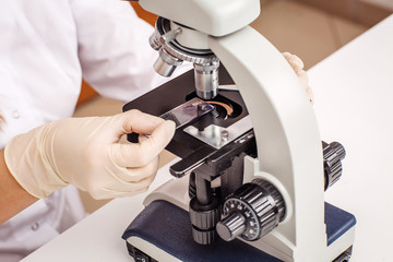 science veterinarian working on microscope. working woman research in lab. medicine, pet, health...