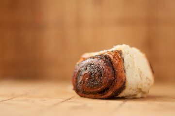 delicious Homemade muffins roll with poppy seeds in warm color background