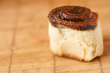 delicious Homemade muffins roll with poppy seeds in warm color background