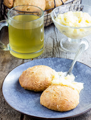 cheese buns with cream in a metal basket.