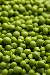 Fresh green peas background, close up