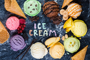 Selection of colorful ice cream scoops on marble background