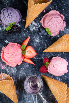 Selection of colorful berry ice cream on marble background