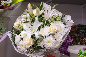 Bunch of large white chrysanthemums lily gypsophila roses