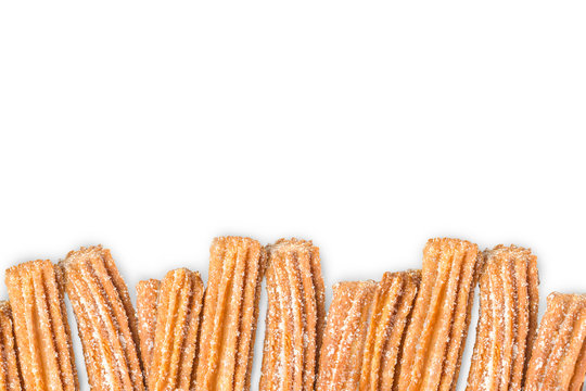 Churros arranged in row isolated on white background
