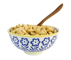 Isolated bowl of cereal with wooden spoon.