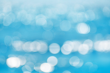 Sea blurred bokeh background with patches of light