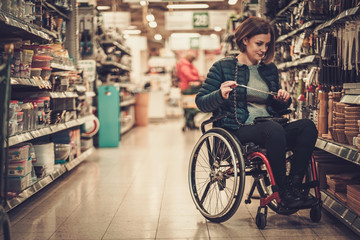 Disabled woman in a wheelchair in a department store