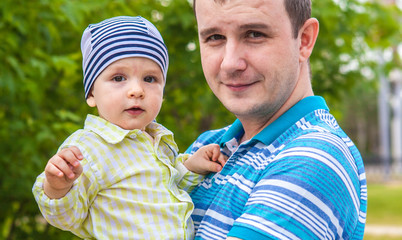 father and son walking in the park