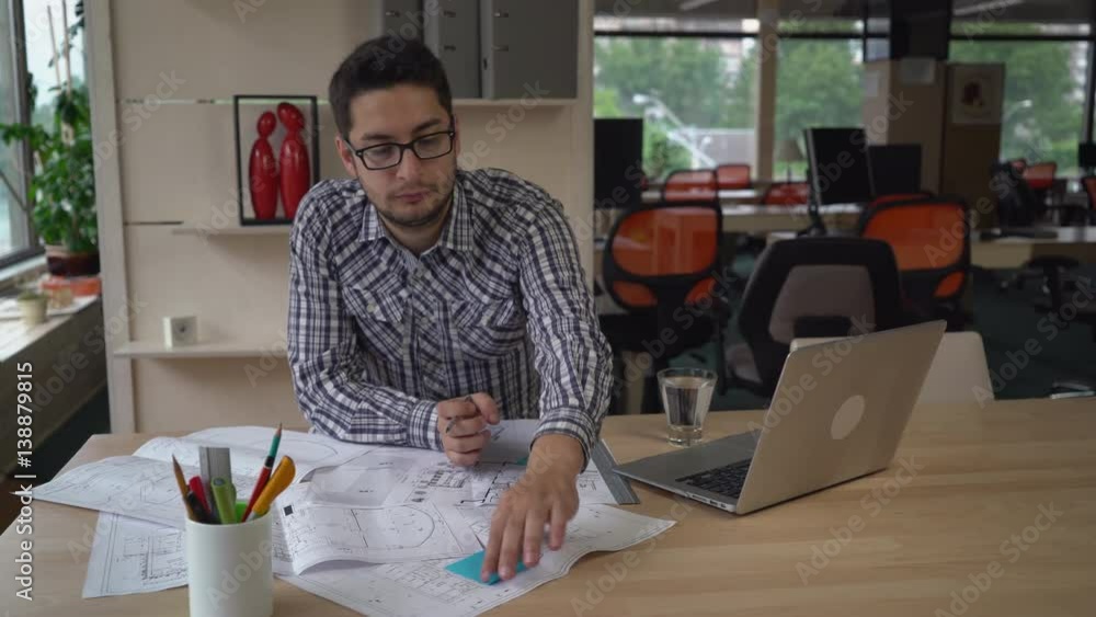 Poster professional engineer stick reminders on sketch blueprint.