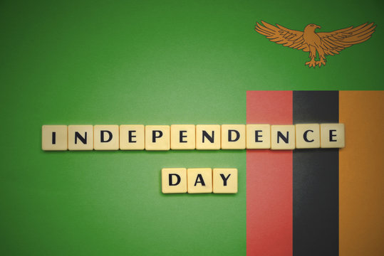 letters with text independence day on the national flag of zambia.