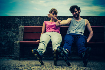 Young people friends relaxing on bench.