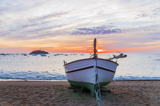 Fototapeta fishing boat on the coast of Tossa de Mar, Spain
