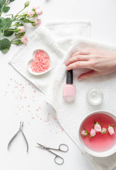 Obraz na płótnie Canvas salt and cream for nail care in spa top view