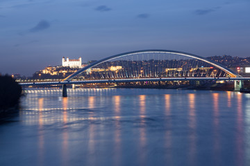 Old town, riverside, Bratislava castle, Apollo Bridge, UFO Bridge, New Bridge shoot during dusk from above river Danube, Slovakia