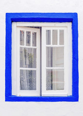 window in the facade of house in Portugal