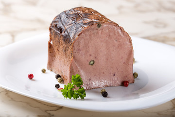 Special liver pate made from different types of meat with peppercorns