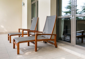 Two chaise longue on balcony