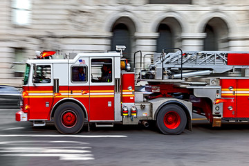 fire trucks and firefighters brigade in the city
