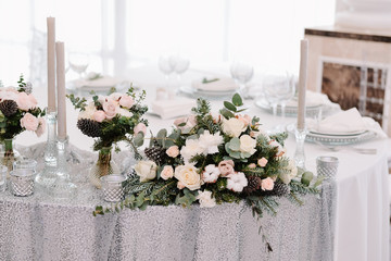 Winter wedding table decoration, silver and beige colours, restaurant serving
