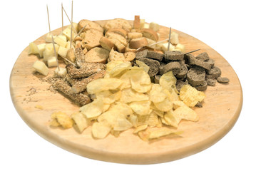assorted chips and crackers on a wooden tray