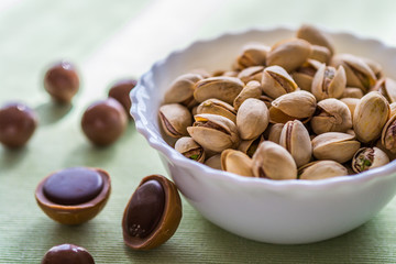 Hazelnut candies and white ball of nuts.