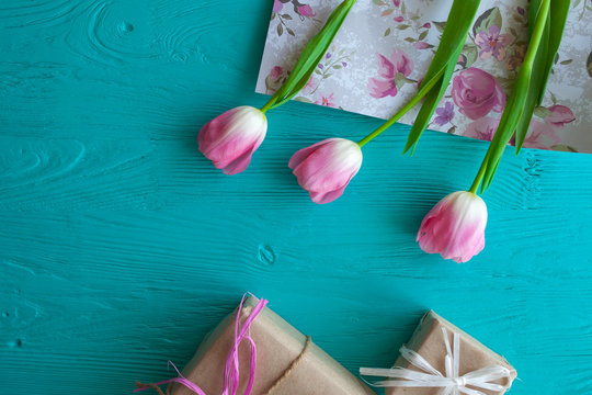 Mother's Day, woman's day. tulips ,presents on wooden background