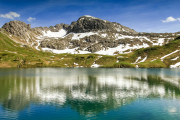 Remote lake up high in the alpine mountains. Schrecksee.