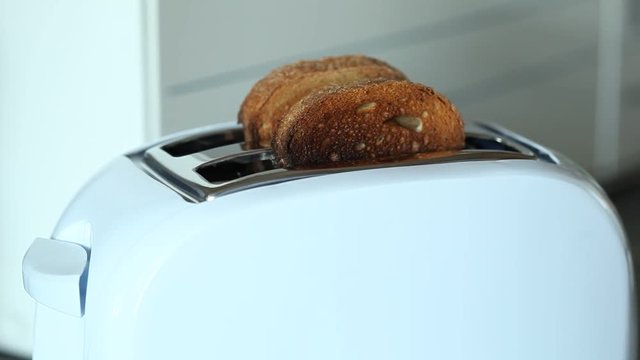Crispy bread popping out of toaster