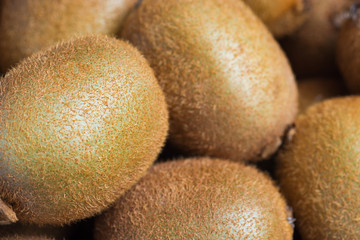 Juicy kiwi fruit on wooden background, room for text. selective focus