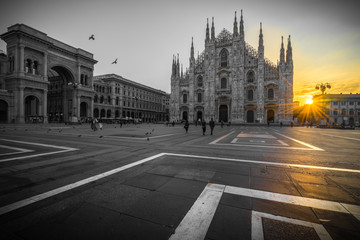Duomo cathedral with beautiful sunrise flare, Milan. Italy  - Powered by Adobe